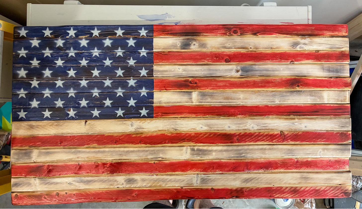 Rustic wood American flag with a natural stain finish as patriotic wall decor